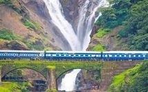 Majestic Dudhsagar Waterfalls surrounded by greenery
